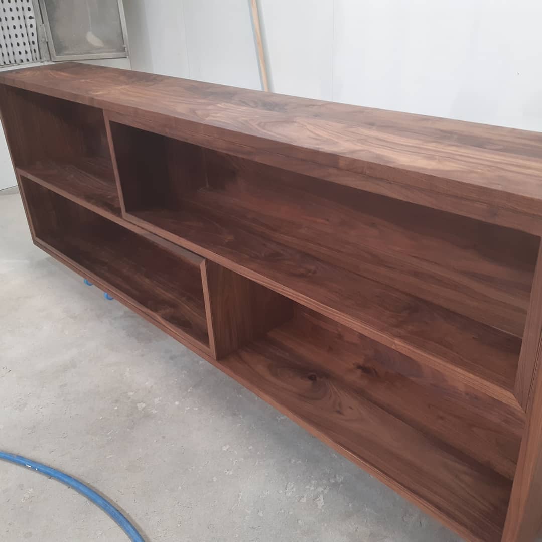 Dark timber bookshelf with multiple compartments