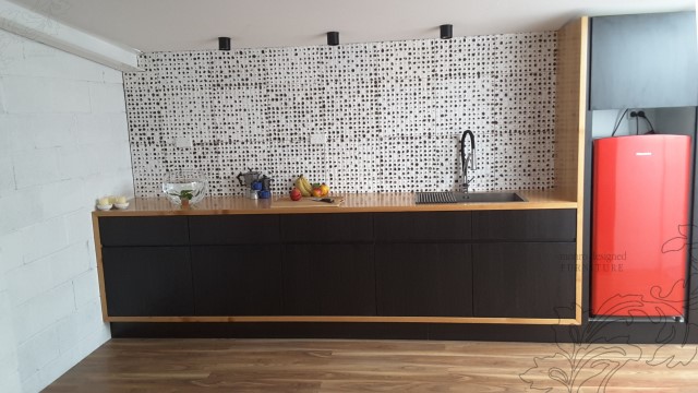Dark timber kitchen bench-top with red fridge