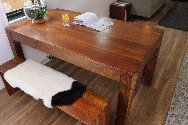 Timber dining table with two wooden benches