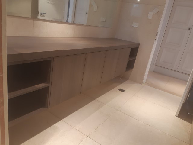 Long dark timber floating bathroom vanity